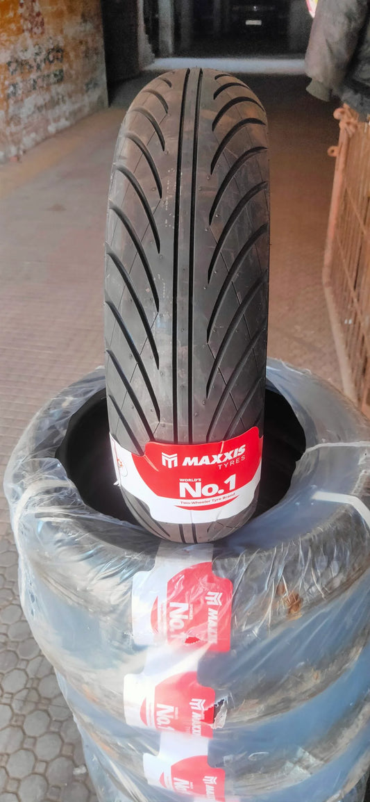 Maxxis tire with a red label on a pile of tires.